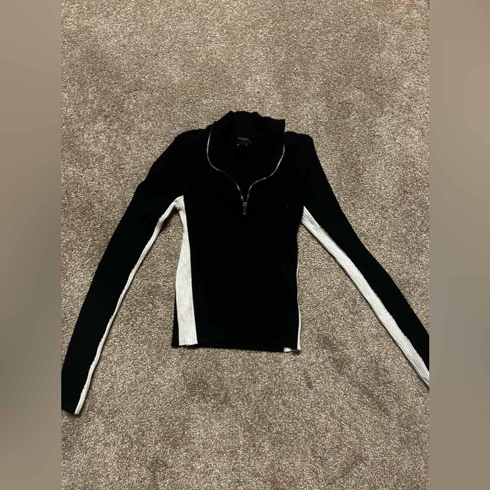 White and black cropped sweater.